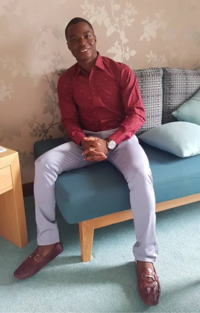 Platinum Star Houffoue Yao Hyacinthe Shares His Direct Selling Success Tips 2 Houffoue Yao Hyacinthe sitting on a couch